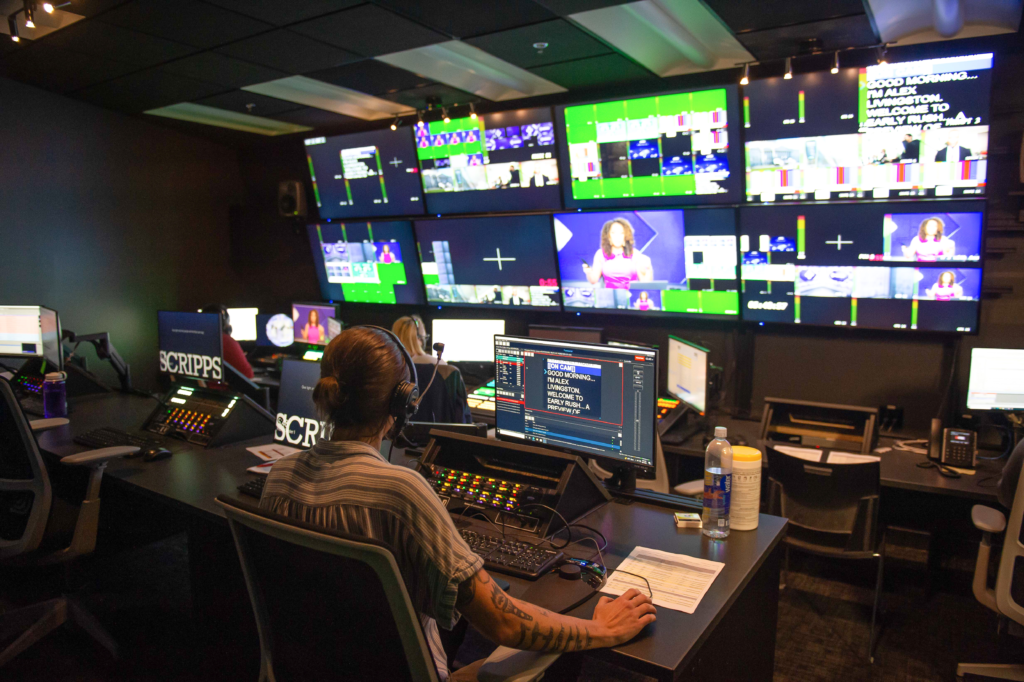 Newsy news room, monitors and crew working to put on an episode of Newsy

Newsycontrolroom.png 